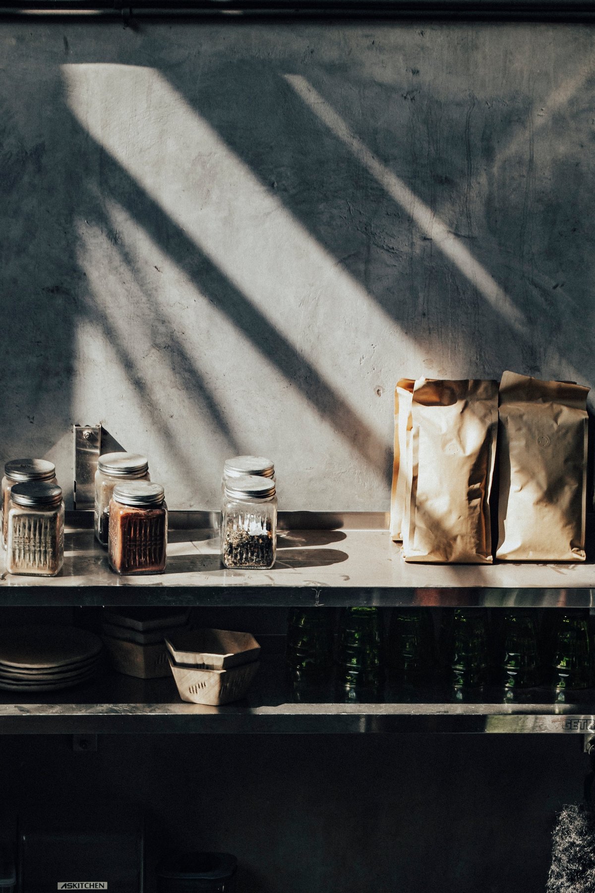 Glass jars and packaging pouches on a shelf