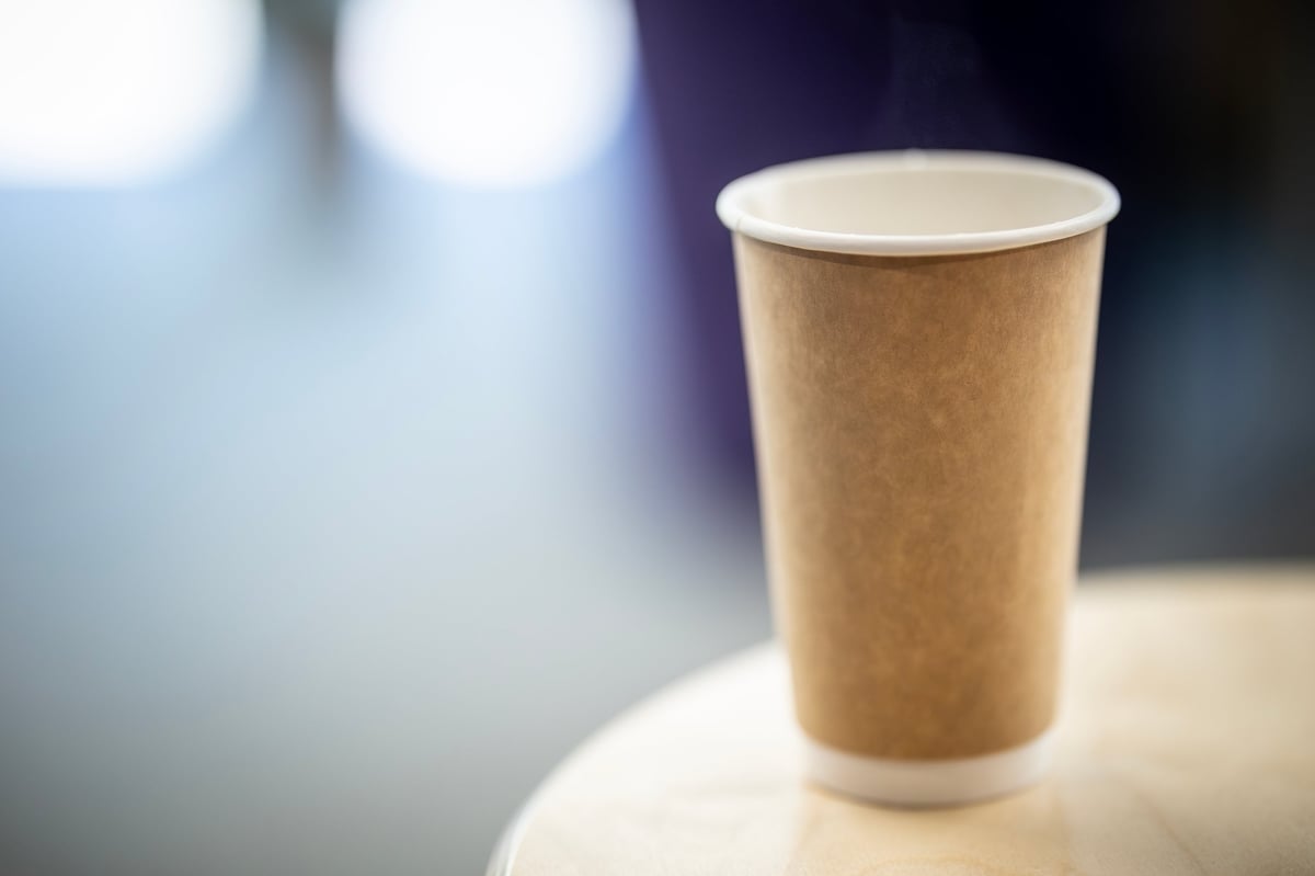 Row of custom printed paper hot cups