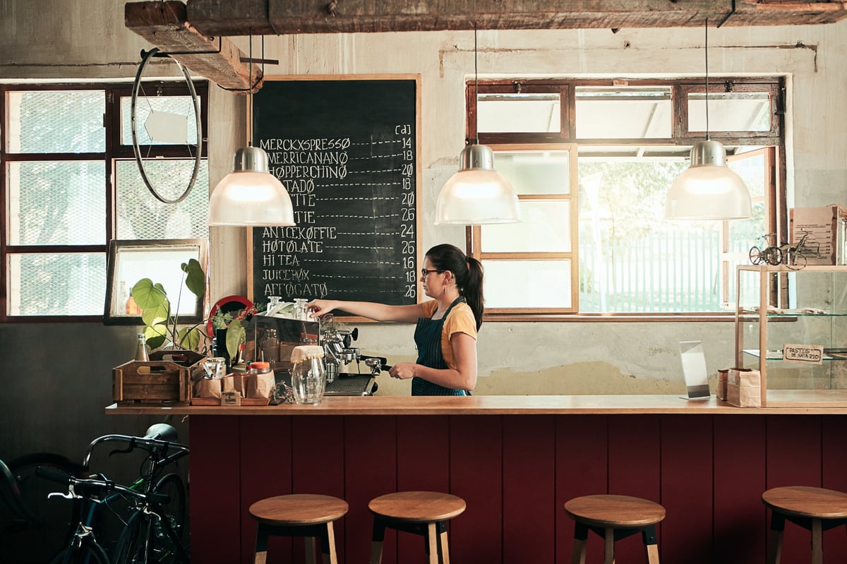 Barista preparing espresso in a café